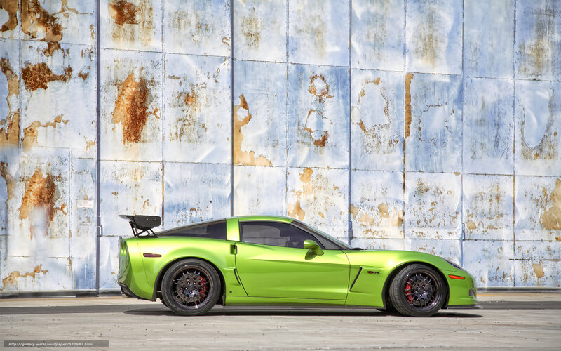 Green sports car on concrete