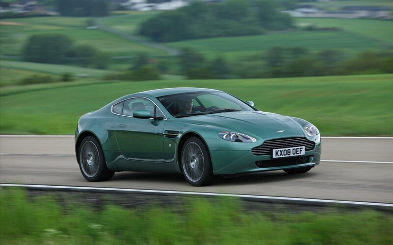 green sports car on country road