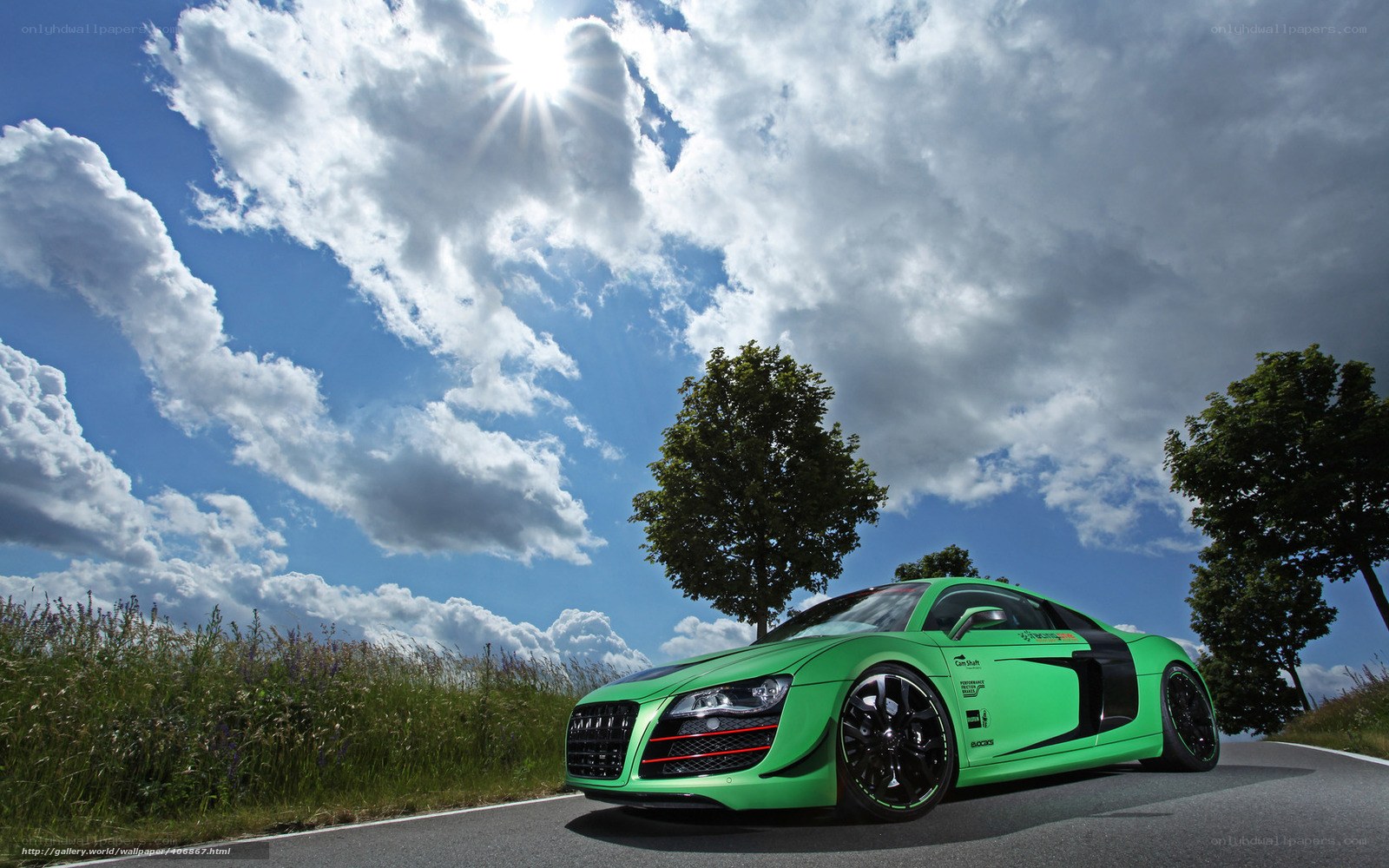 Green sports car on country road