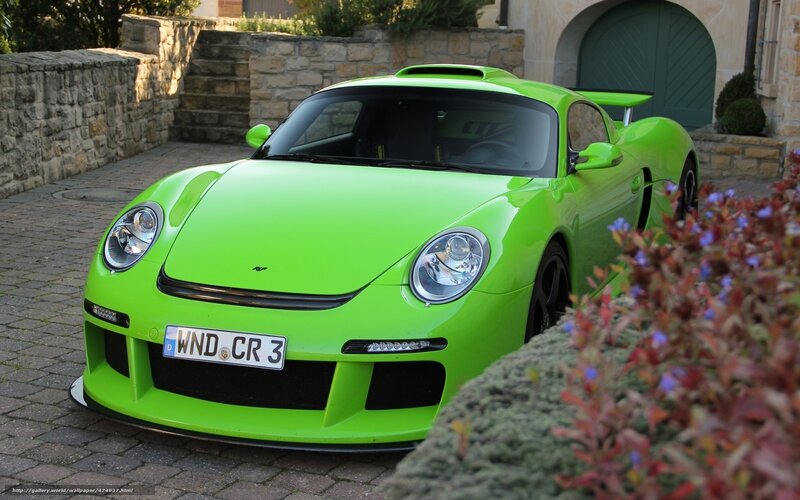 green sports car on driveway
