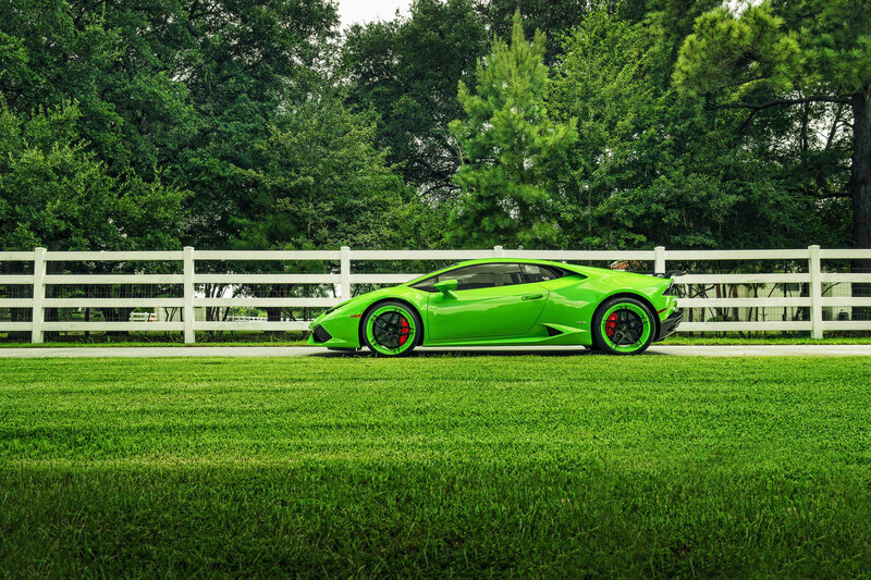 Green sports car on grass