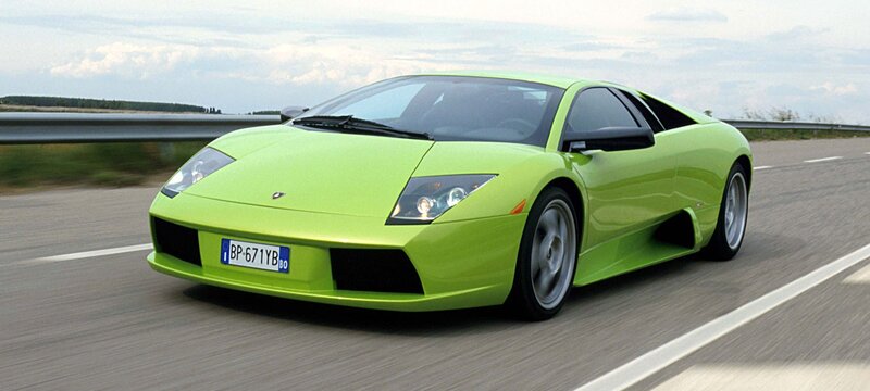 green sports car on highway