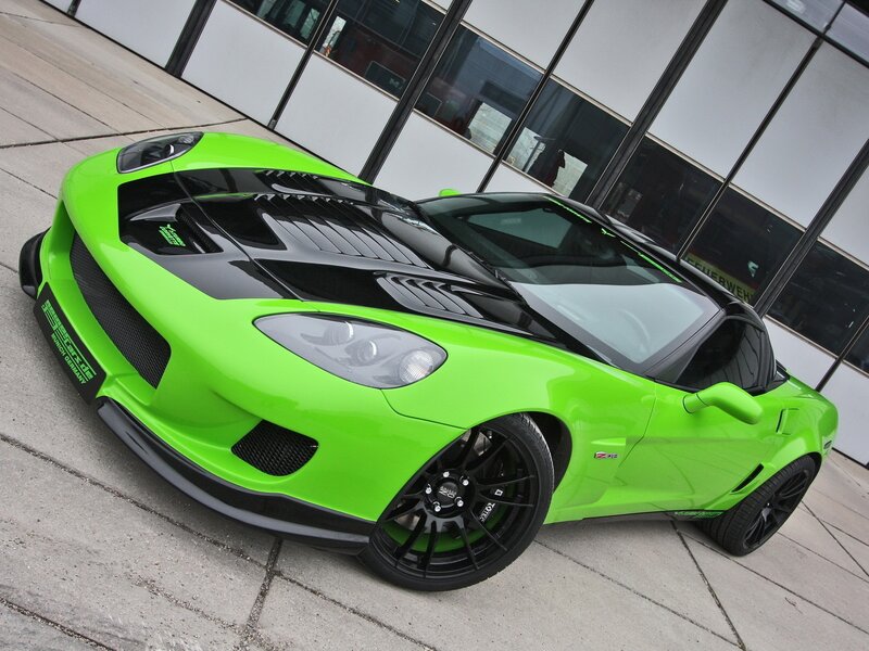 green sports car on pavement