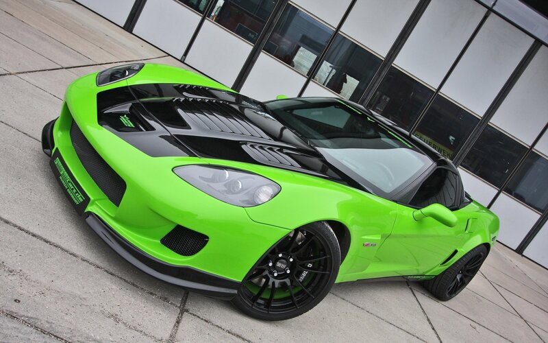 green sports car on pavement