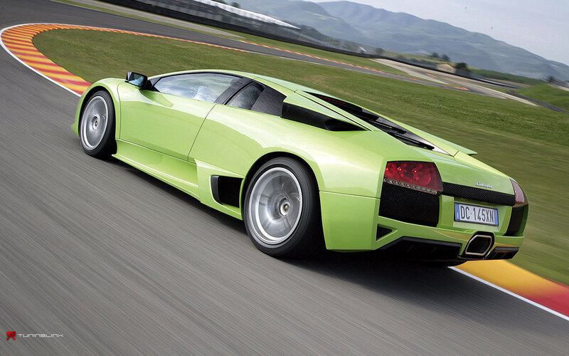 green sports car on racetrack