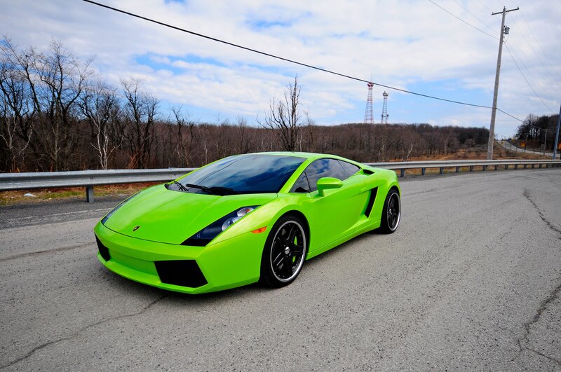 green sports car on road