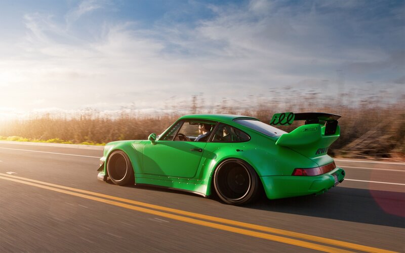 green sports car on road
