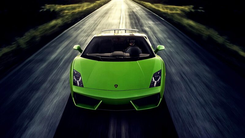 green sports car on road