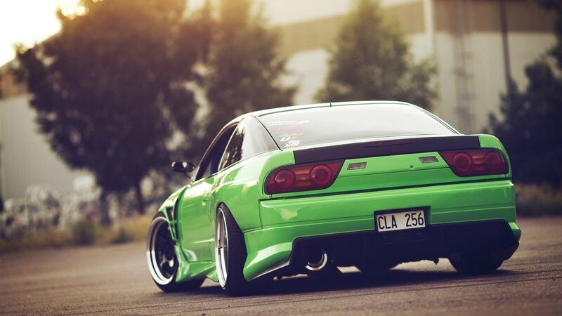 green sports car on road