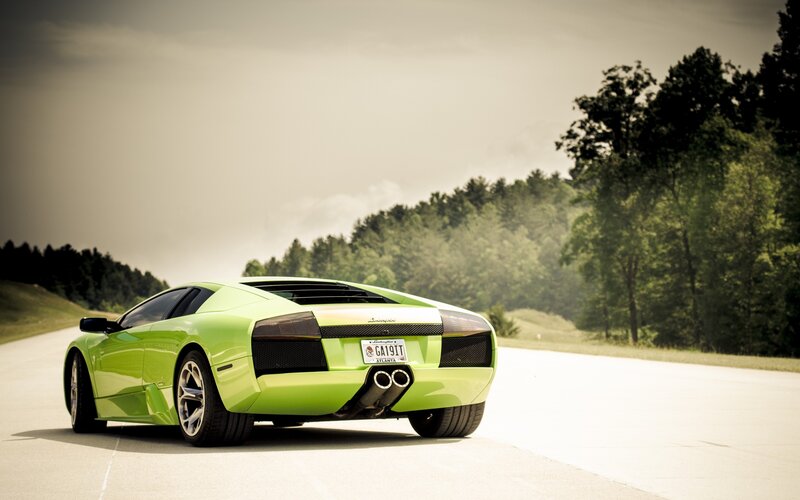 green sports car on road
