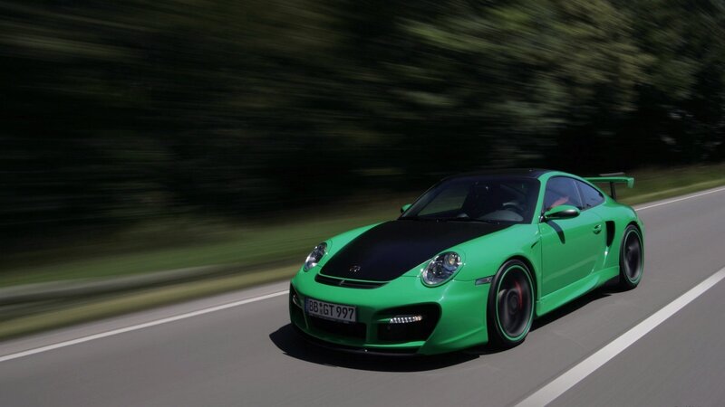 green sports car on road
