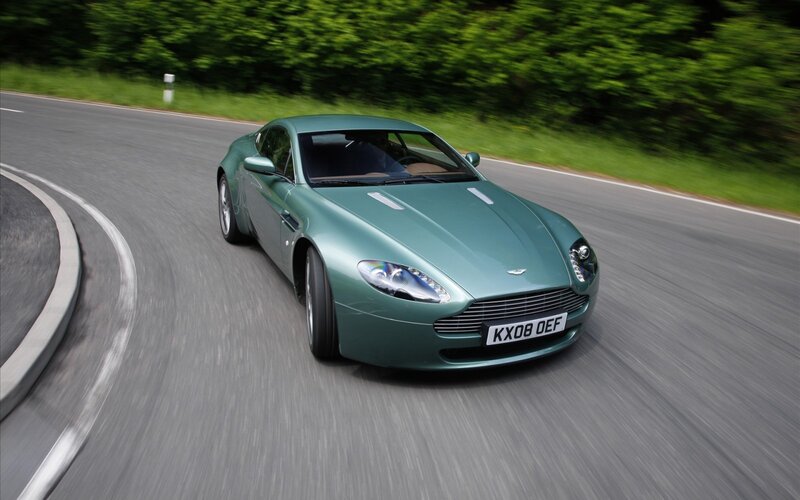 green sports car on road