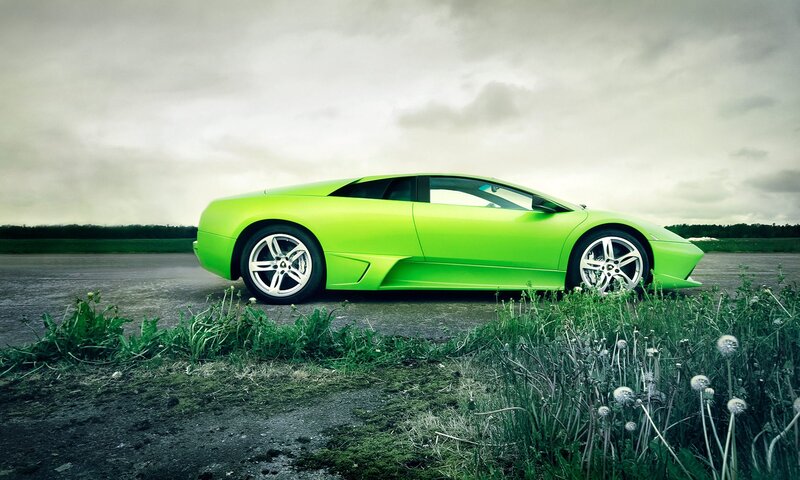 green sports car on road