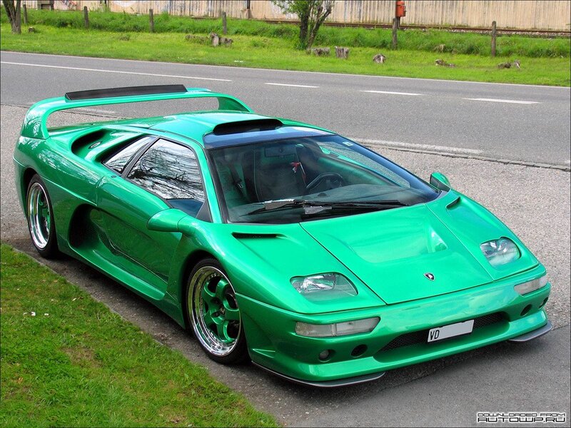 green sports car on roadside
