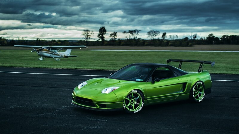 Green Sports Car on Runway — Dramatic