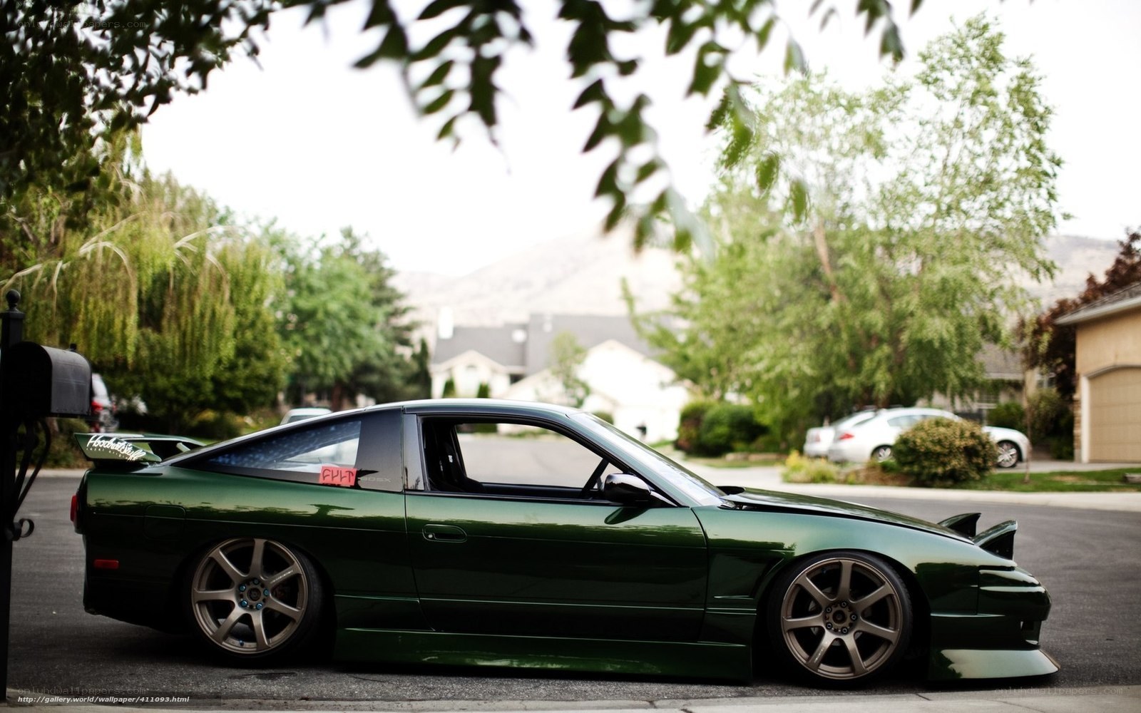 green sports car on street