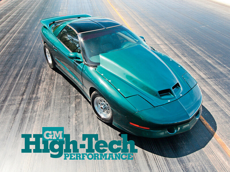 Green sports car on track