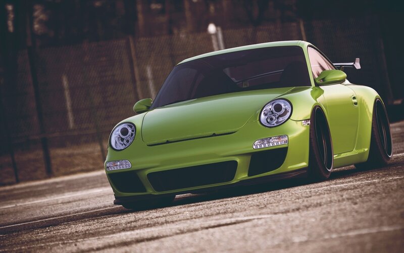 green sports car on track