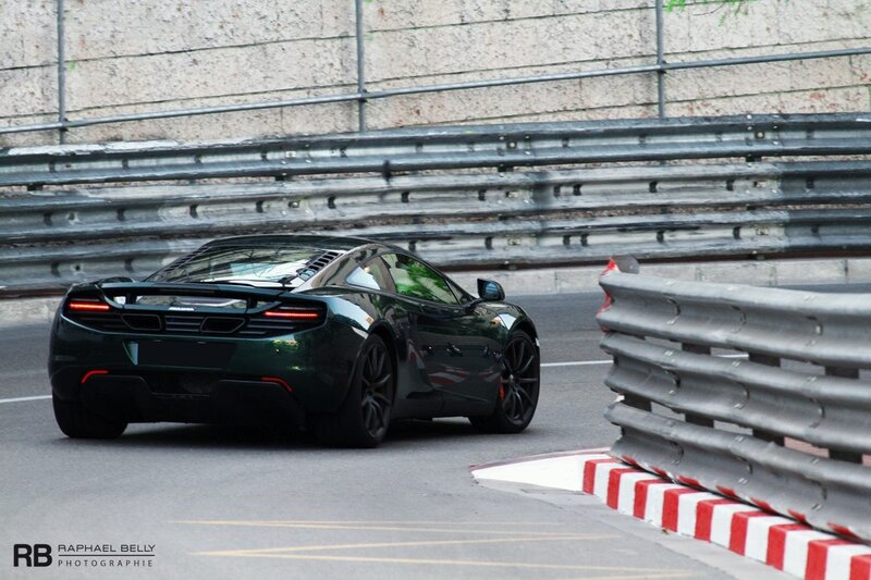green sports car on track