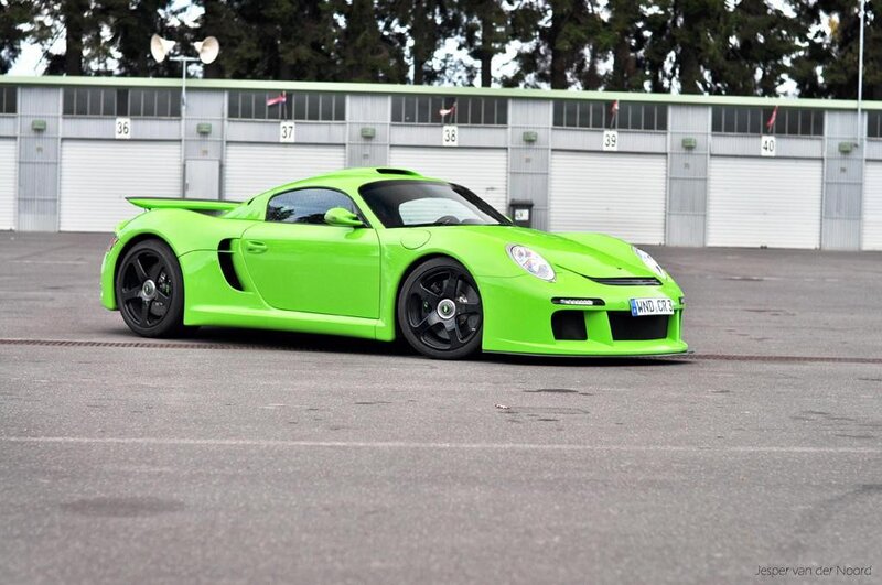 green sports car on track