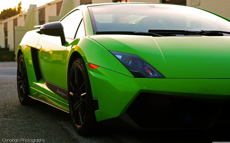 green sports car parked