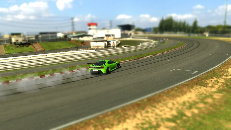 green sports car racing
