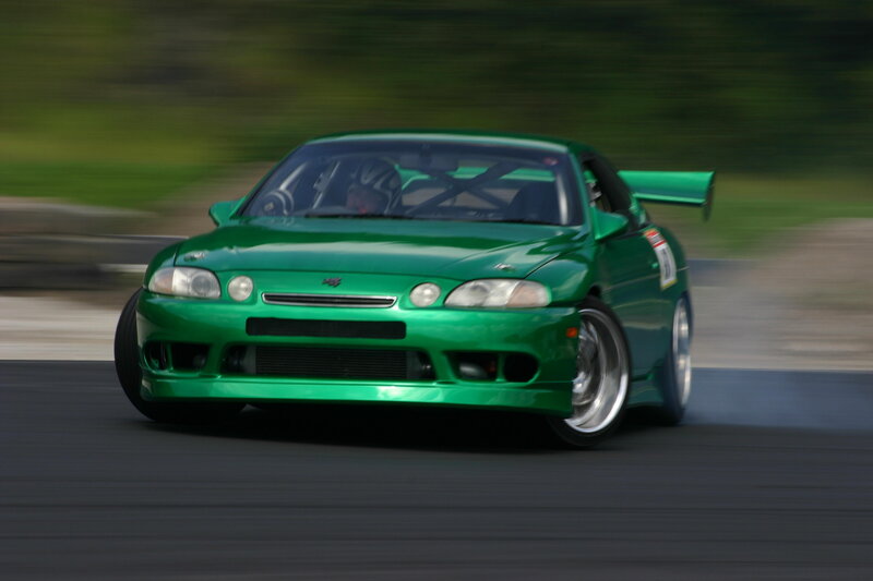 green sports car racing