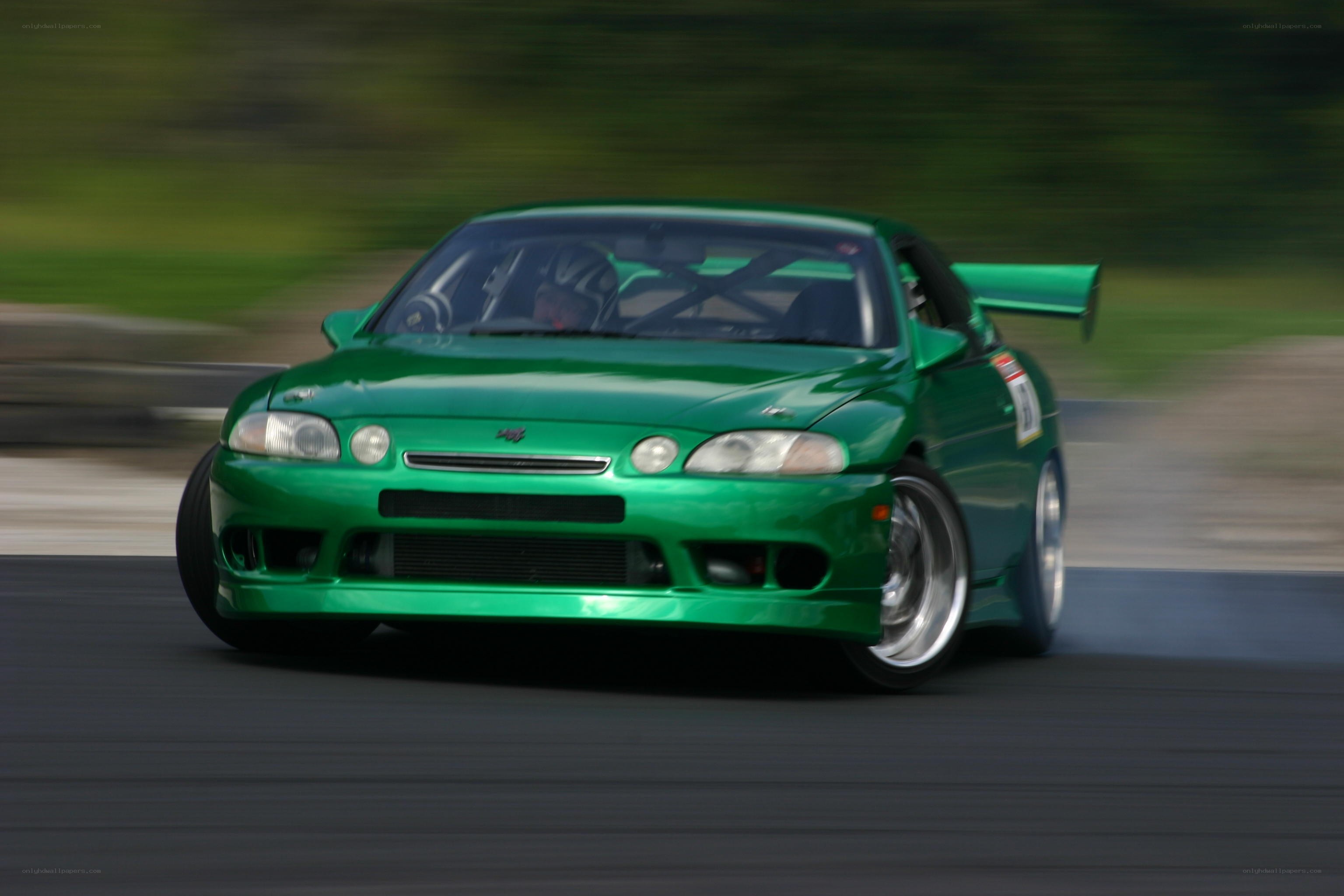 green sports car racing