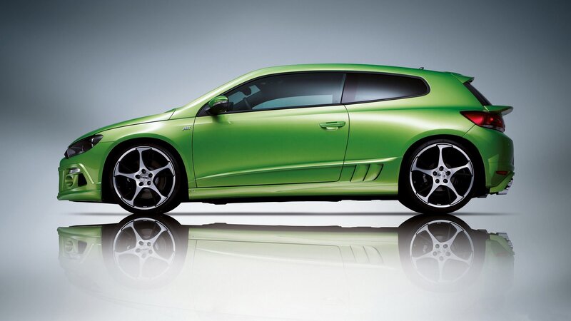 green sports car side profile