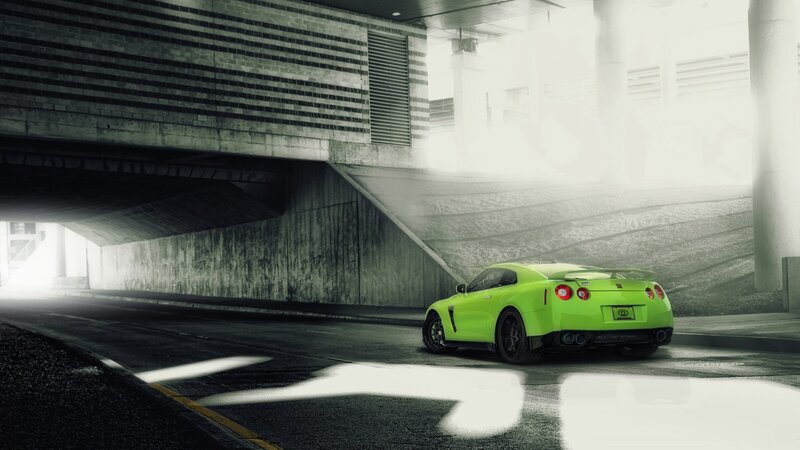 green sports car under overpass