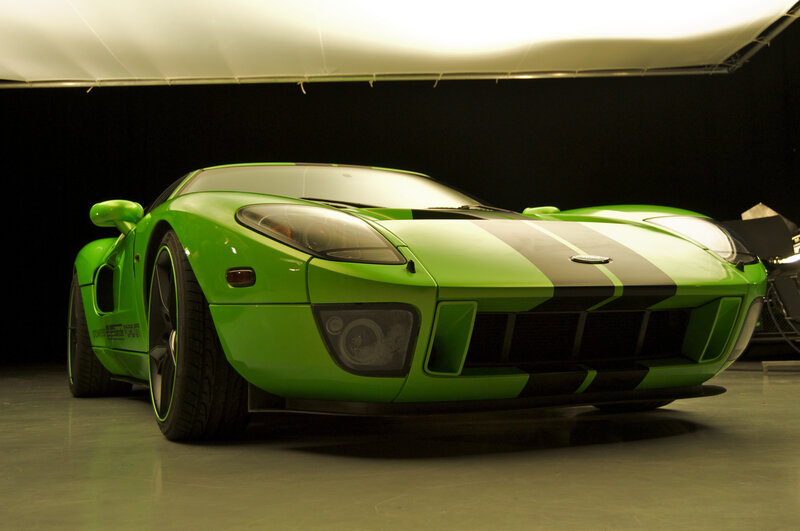 green sports car with black stripes