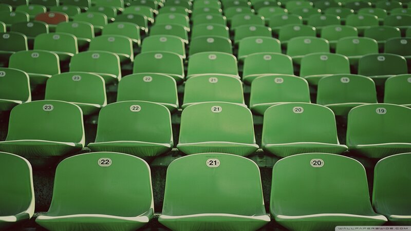 Green stadium seats in rows