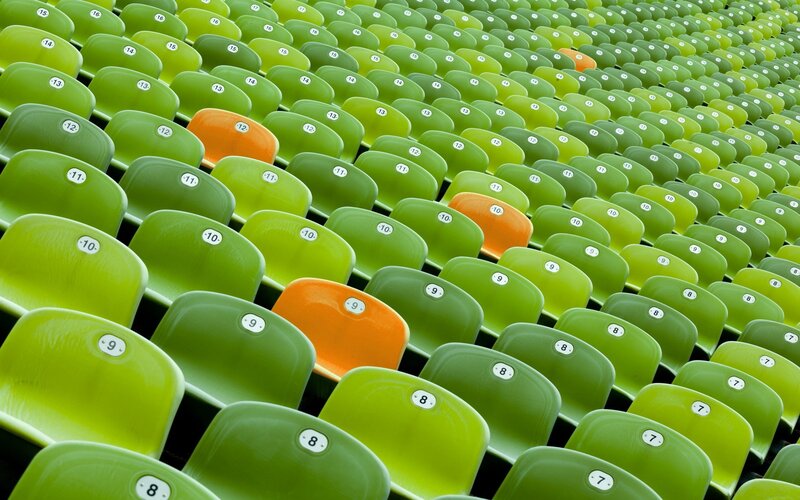 Green stadium seats with orange accents