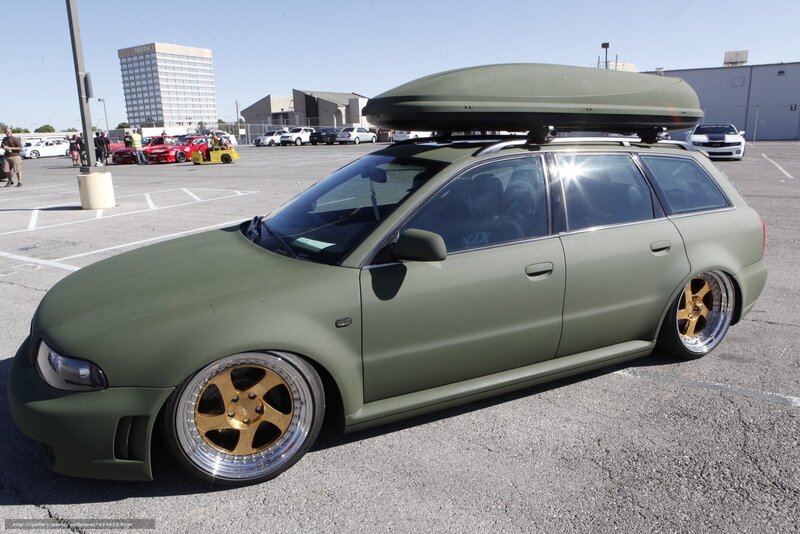 green station wagon with roof box
