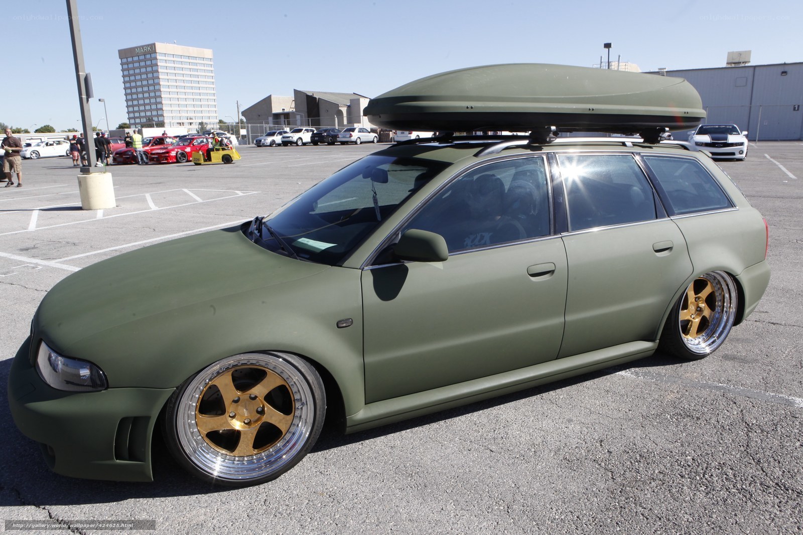 green station wagon with roof box