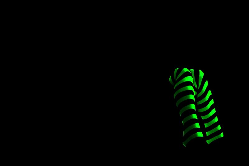 green striped object on black