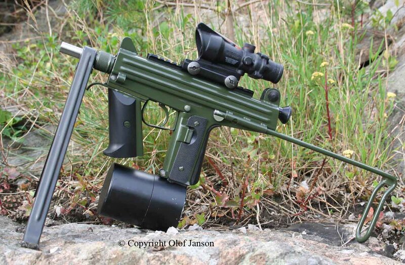 Green submachine gun with scope