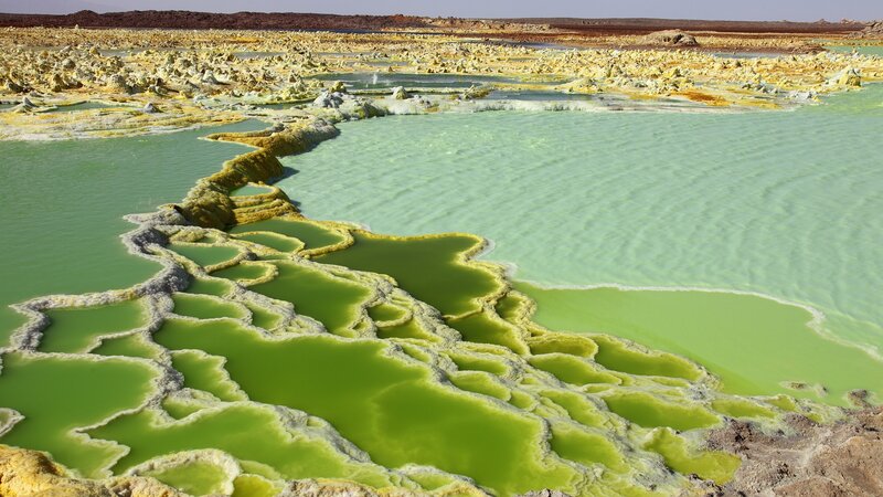 Green sulfur pools in a volcanic landscape