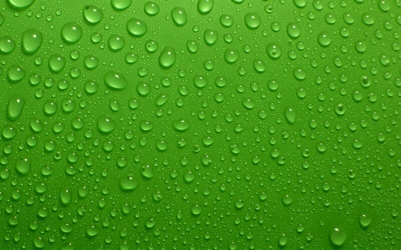 green surface with water droplets