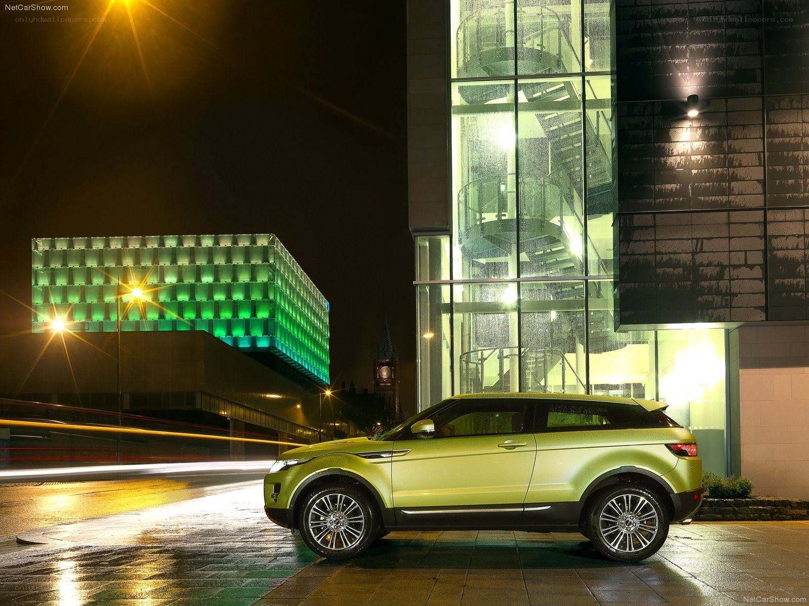 Green SUV at night in city