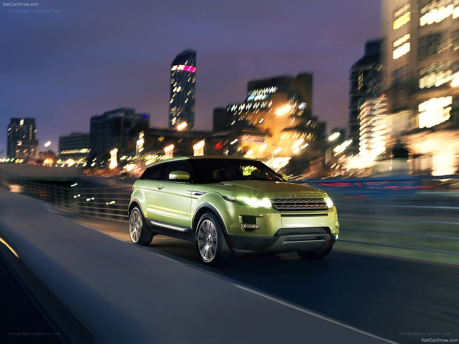 Green SUV driving at night