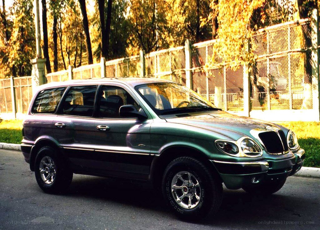 green suv parked on street