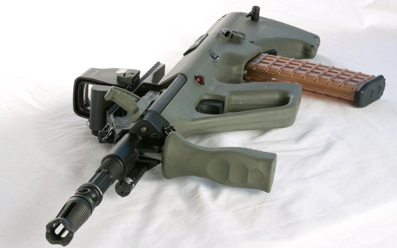 green tactical rifle with scope