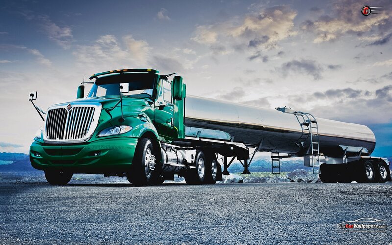 green tanker truck on road