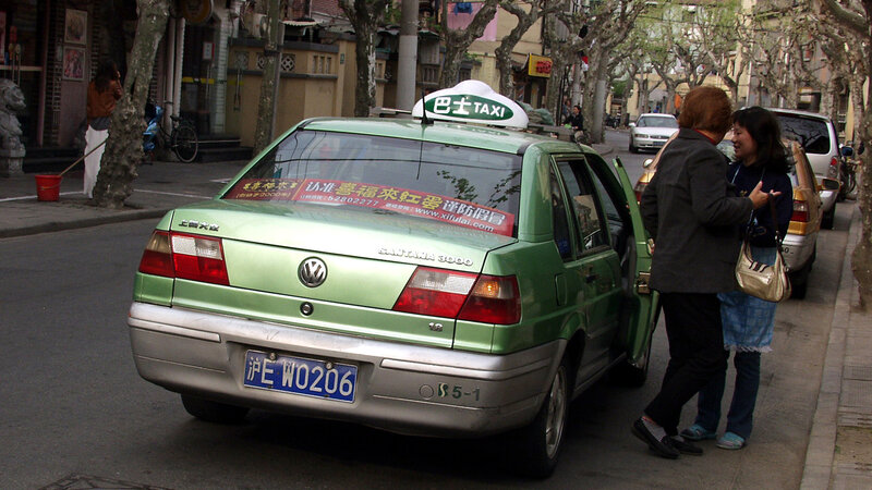 Green Taxi on Street