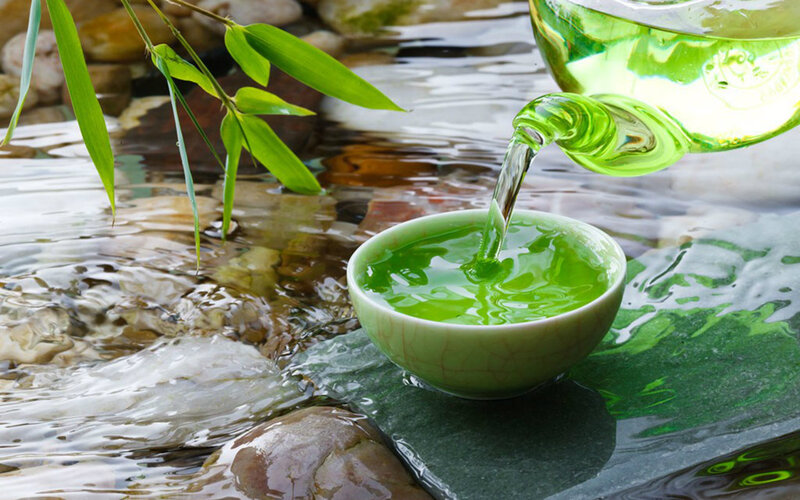 Green Tea Being Poured — Serene
