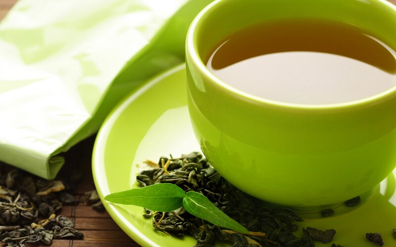 Green Tea Cup and Leaves