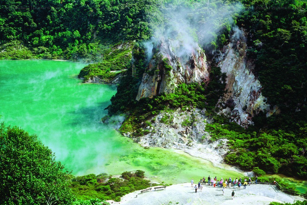 green thermal lake with steam