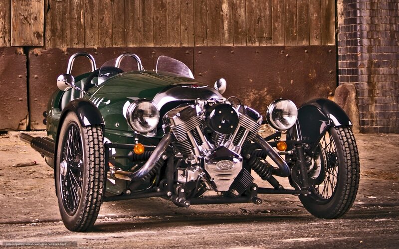 Green three-wheeled sports car