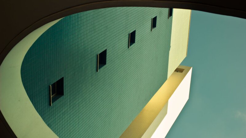 green tiled building facade